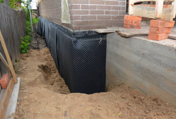 Happy homeowners after waterproofing job in Babylon